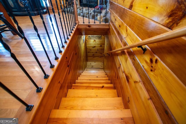 staircase featuring wood finished floors