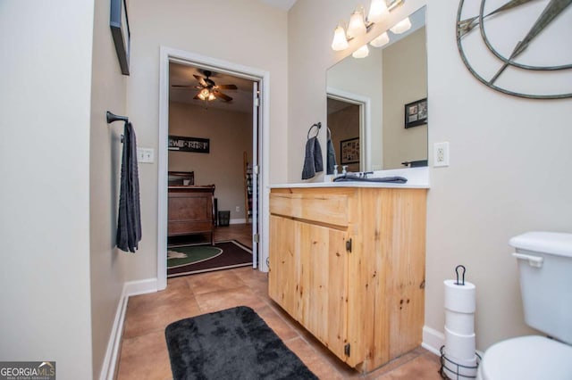 bathroom featuring toilet, a ceiling fan, tile patterned flooring, and vanity