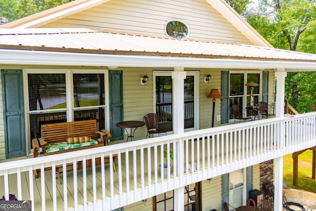 view of front of property featuring covered porch and metal roof