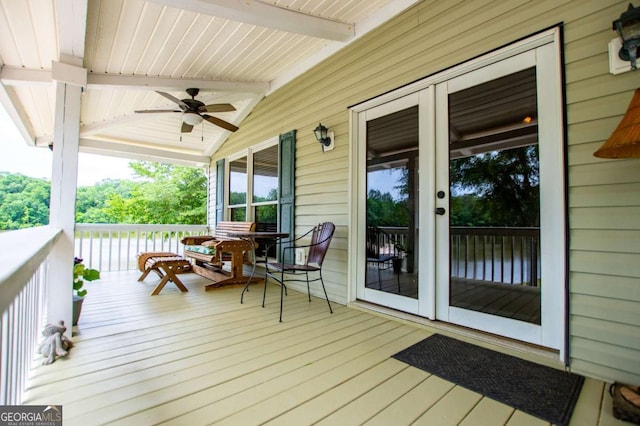 wooden porch with ceiling fan