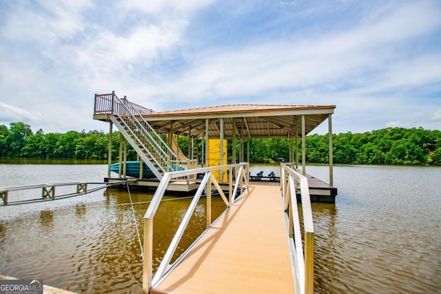 dock area with a water view and boat lift