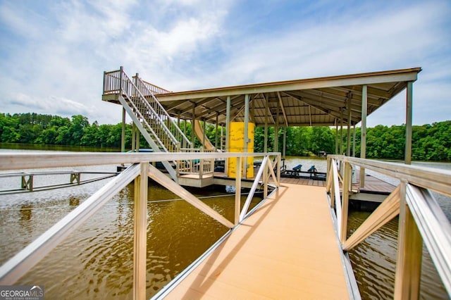 dock featuring a water view and stairs