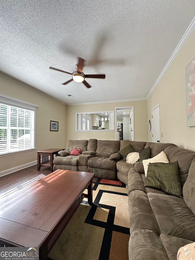 6940 Treeline Dr, Cumming, GA 30028 - living area with ornamental molding, a ceiling fan, a textured ceiling, and baseboards