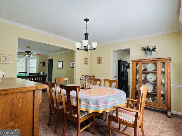 6940 Treeline Dr, Cumming, GA 30028 - carpeted dining space with crown molding, a chandelier, and a textured ceiling