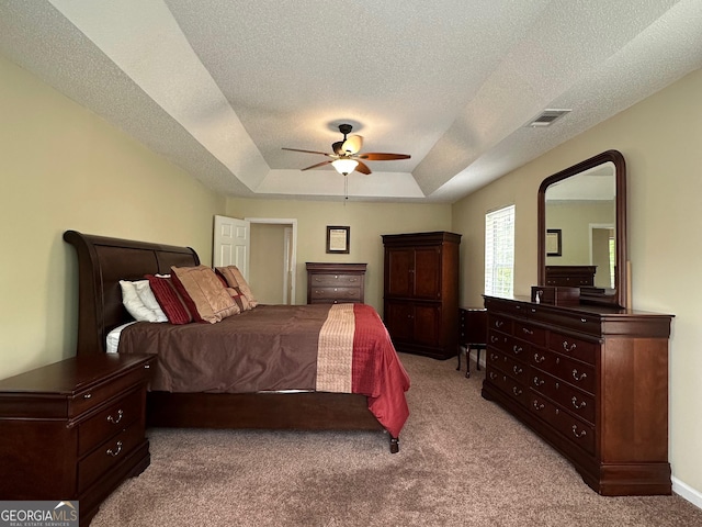6940 Treeline Dr, Cumming, GA 30028 - bedroom featuring carpet flooring, a raised ceiling, a ceiling fan, and a textured ceiling