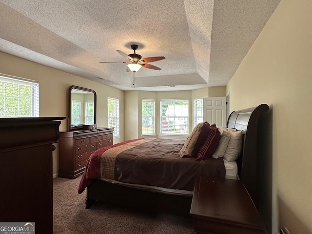 6940 Treeline Dr, Cumming, GA 30028 - bedroom featuring a textured ceiling, a raised ceiling, carpet, and ceiling fan