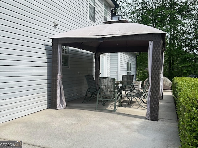 6940 Treeline Dr, Cumming, GA 30028 - view of patio / terrace featuring a gazebo and outdoor dining area