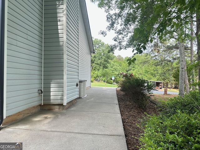 6940 Treeline Dr, Cumming, GA 30028 - view of home's exterior with a patio