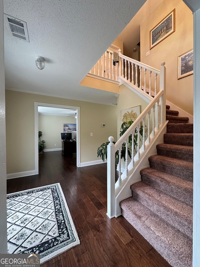 6940 Treeline Dr, Cumming, GA 30028 - staircase featuring wood finished floors, baseboards, and a textured ceiling