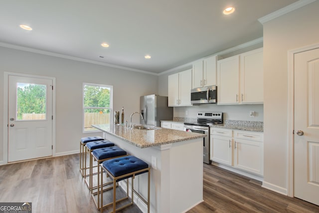 8747 Lakeview Commons Lot 1, Jonesboro, GA 30238 - kitchen with stainless steel appliances, ornamental molding, a sink, a center island with sink, and dark wood-style floors