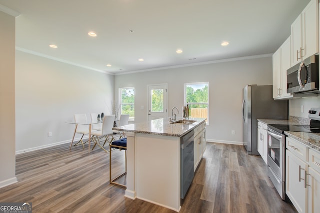 8747 Lakeview Commons Lot 1, Jonesboro, GA 30238 - kitchen featuring stainless steel appliances, a sink, a kitchen island with sink, white cabinetry, and dark wood finished floors