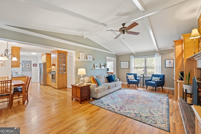 living room with a ceiling fan and light wood finished floors