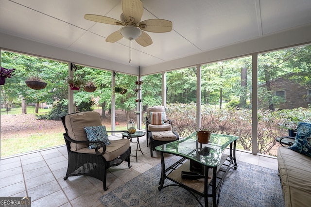 sunroom / solarium with a ceiling fan, outdoor lounge area, and healthy amount of natural light