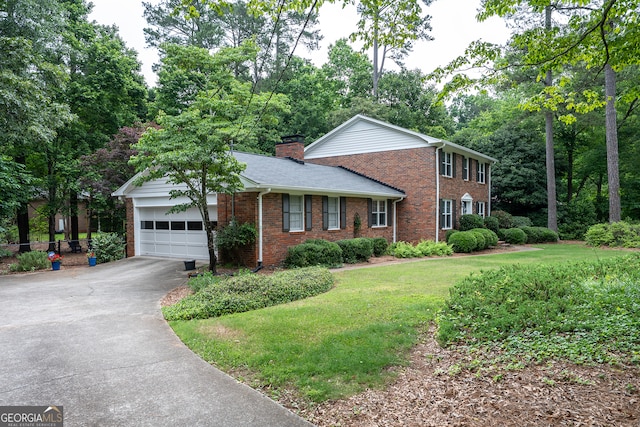 view of front facade with brick siding, asphalt driveway, a garage, a chimney, and a front lawn