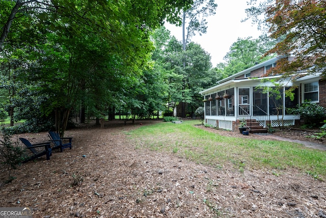 view of yard featuring a sunroom