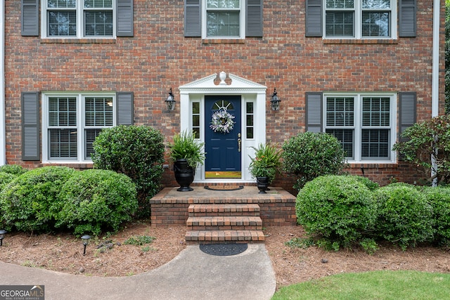entrance to property with brick siding