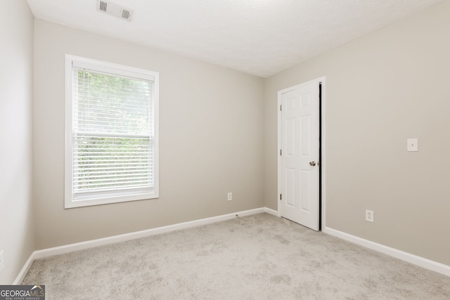 11576 Kades Trl, Hampton, GA 30228 - spare room featuring light carpet and baseboards