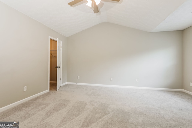 11576 Kades Trl, Hampton, GA 30228 - unfurnished bedroom featuring lofted ceiling, light carpet, baseboards, a spacious closet, and ceiling fan