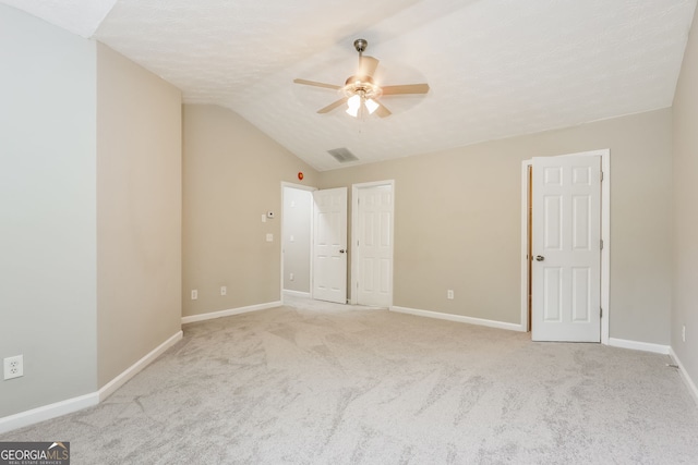 11576 Kades Trl, Hampton, GA 30228 - unfurnished bedroom featuring carpet flooring, baseboards, lofted ceiling, and ceiling fan