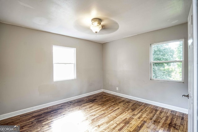 1903 Phillips Ave, East Point, GA 30344 - unfurnished room with wood finished floors, baseboards, and ceiling fan