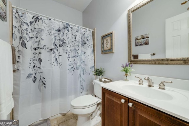 bathroom featuring tile patterned flooring, toilet, vanity, and a shower with curtain