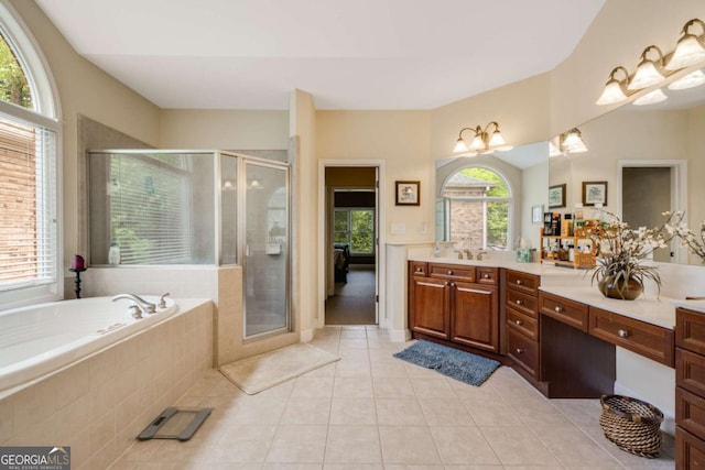 bathroom featuring vanity, tile patterned floors, a bath, and a stall shower