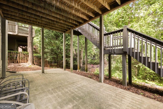 view of patio featuring stairs and a wooden deck