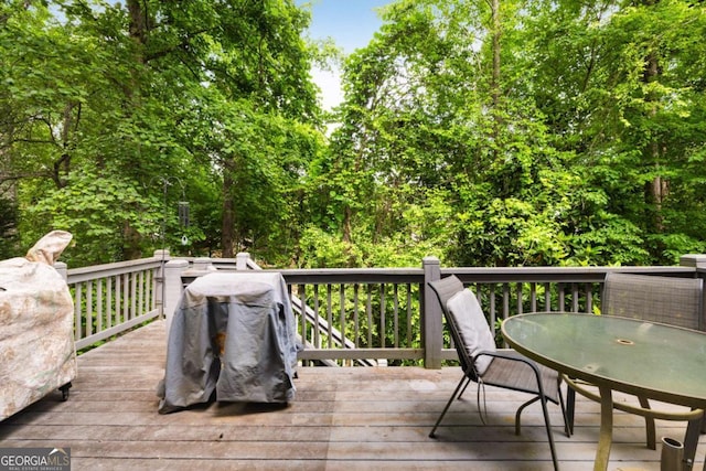 wooden deck with outdoor dining area
