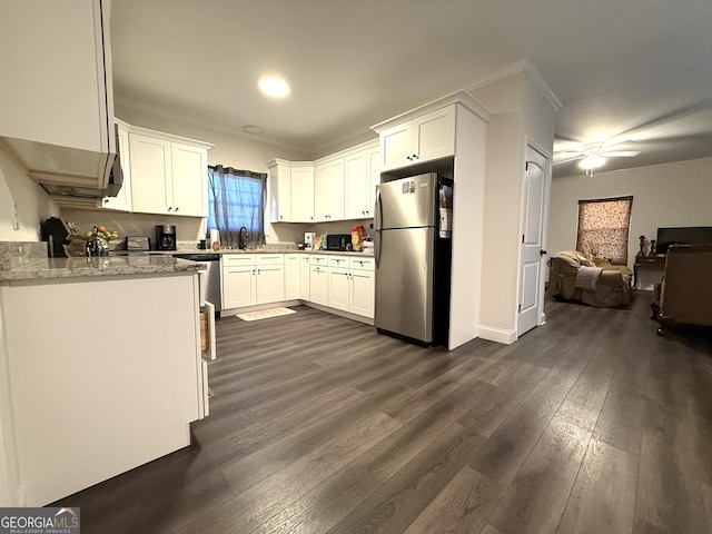 214 Evans St, Athens, GA 30606 - kitchen with stainless steel appliances, white cabinetry, open floor plan, dark wood-type flooring, and ceiling fan