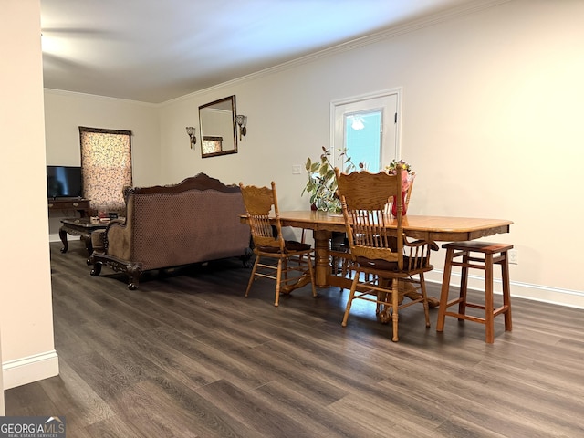 214 Evans St, Athens, GA 30606 - dining room with ornamental molding, dark wood-style floors, and baseboards