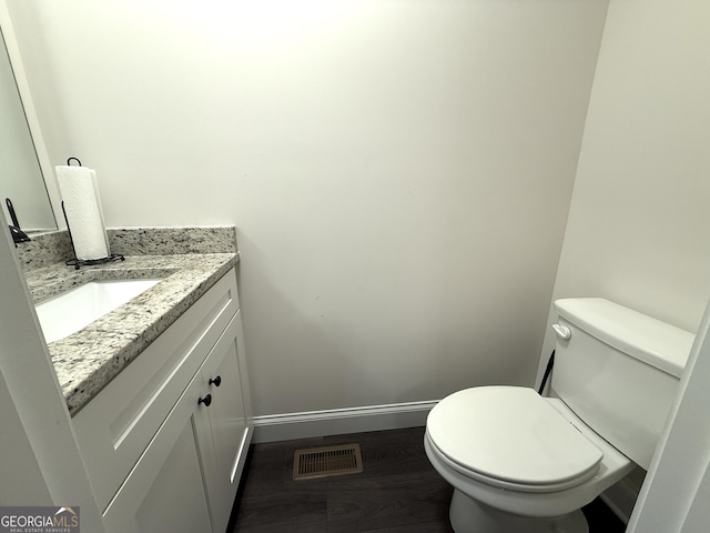 214 Evans St, Athens, GA 30606 - half bathroom featuring baseboards, vanity, and toilet