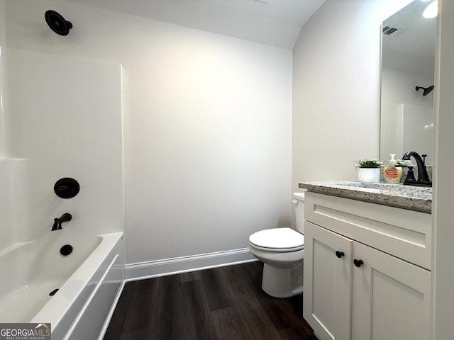 214 Evans St, Athens, GA 30606 - bathroom featuring vanity, wood finished floors, toilet, shower / tub combination, and baseboards