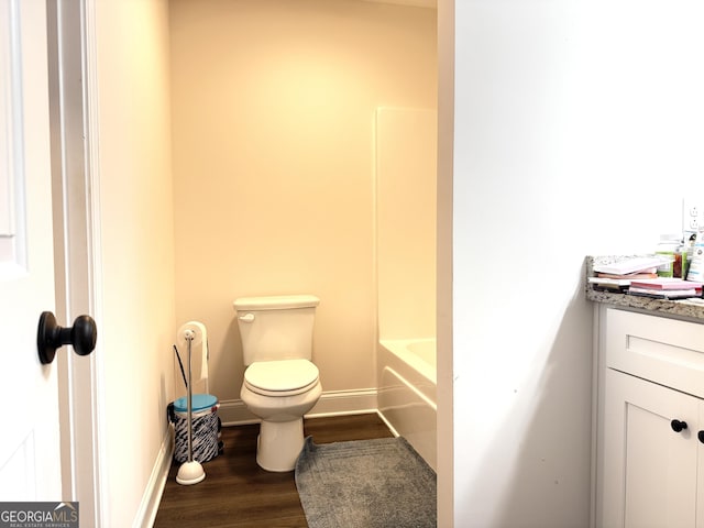 214 Evans St, Athens, GA 30606 - bathroom with vanity, toilet, wood finished floors, and baseboards