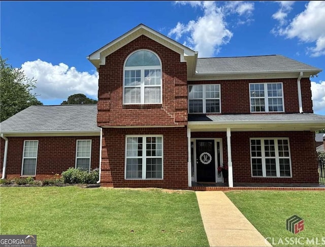 238 Covington Pl, Athens, GA 30606 - view of front of house with a front yard, brick siding, and a shingled roof