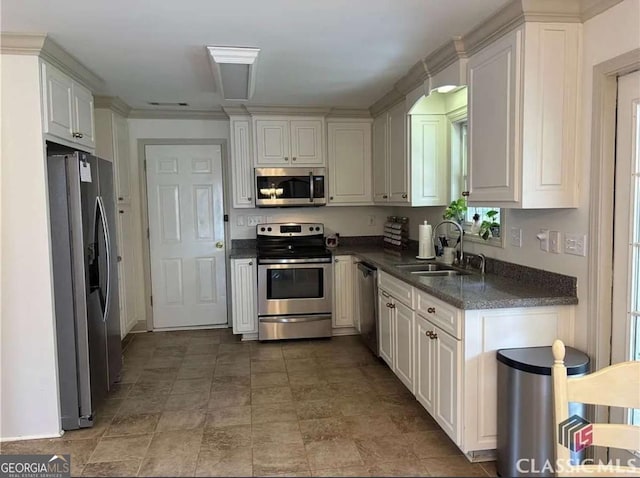 238 Covington Pl, Athens, GA 30606 - kitchen featuring stainless steel appliances, white cabinetry, and stone finish flooring