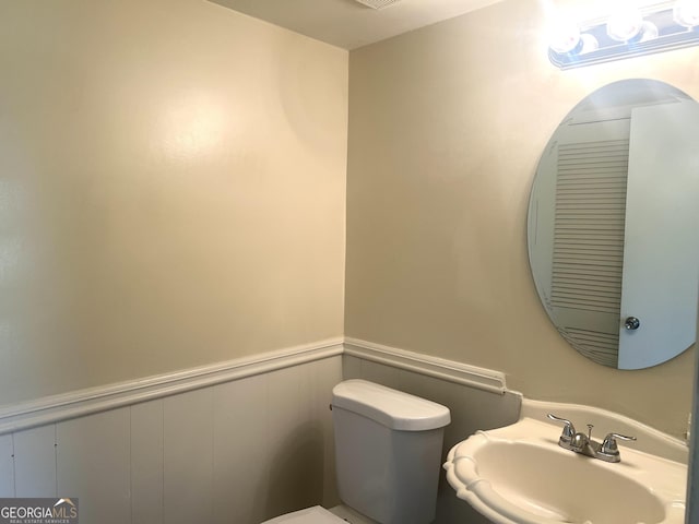 443 S Rays Rd, Stone Mountain, GA 30083 - half bath featuring a sink, wainscoting, and toilet