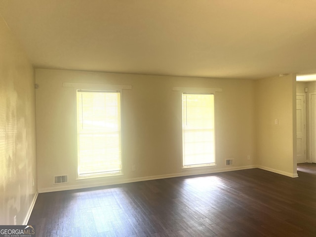443 S Rays Rd, Stone Mountain, GA 30083 - empty room featuring dark wood-type flooring and baseboards