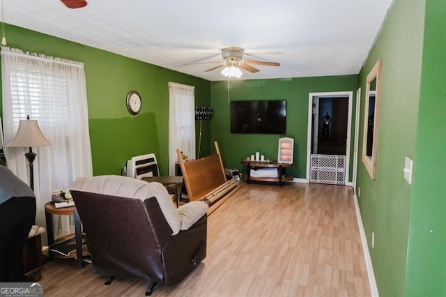 50 Canyon Pass, Cleveland, GA 30528 - living room featuring a ceiling fan, wood finished floors, and baseboards