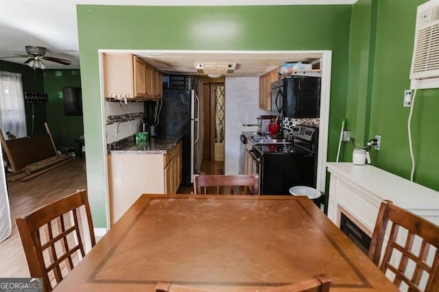 50 Canyon Pass, Cleveland, GA 30528 - kitchen with electric stove, black microwave, a ceiling fan, freestanding refrigerator, and tasteful backsplash
