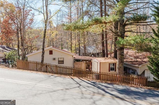 50 Canyon Pass, Cleveland, GA 30528 - view of front of home featuring a fenced front yard and asphalt driveway