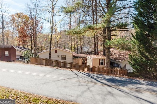 50 Canyon Pass, Cleveland, GA 30528 - view of front of house with a fenced front yard and driveway