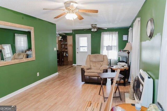 50 Canyon Pass, Cleveland, GA 30528 - living room with heating unit, a ceiling fan, wood finished floors, and baseboards