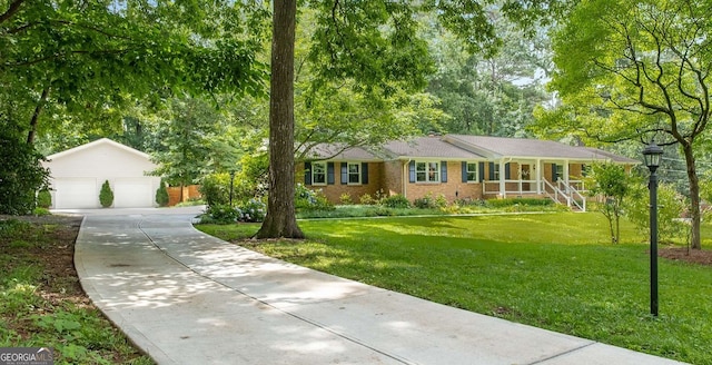 5401 Rosser Rd, Tucker, GA 30087 - ranch-style house featuring an outbuilding, a front yard, and a detached garage