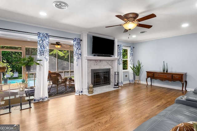 5401 Rosser Rd, Tucker, GA 30087 - living area featuring ceiling fan, a premium fireplace, wood finished floors, crown molding, and recessed lighting