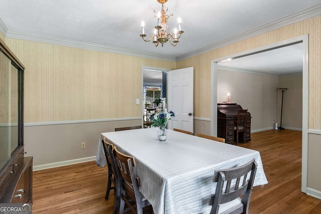 5401 Rosser Rd, Tucker, GA 30087 - dining area with a chandelier, wood finished floors, and ornamental molding