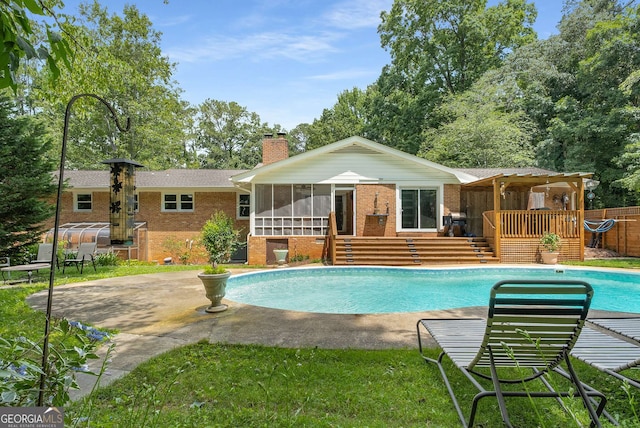 5401 Rosser Rd, Tucker, GA 30087 - swimming pool with a sunroom, a deck, and a patio area