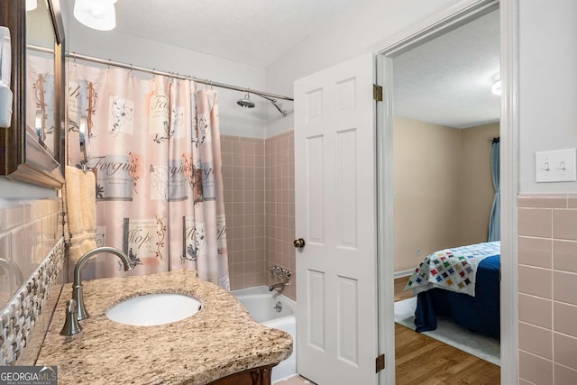 5401 Rosser Rd, Tucker, GA 30087 - ensuite bathroom featuring shower / tub combo with curtain, wood finished floors, and vanity