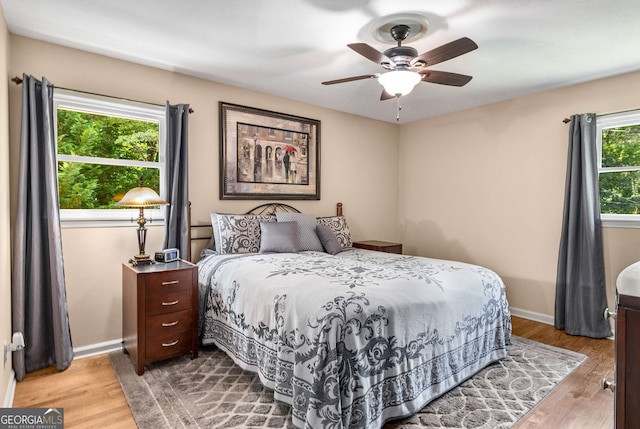 5401 Rosser Rd, Tucker, GA 30087 - bedroom with wood finished floors and a ceiling fan