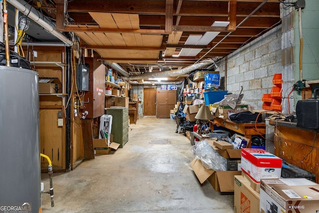 5401 Rosser Rd, Tucker, GA 30087 - unfinished below grade area featuring gas water heater and concrete block wall
