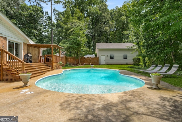 5401 Rosser Rd, Tucker, GA 30087 - view of pool with a patio, a fenced backyard, a deck, an outdoor structure, and stairs